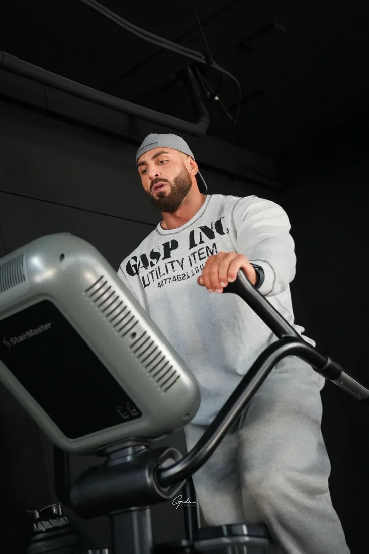 Coach Hassan Ibrahim training cardio on the StairMaster
